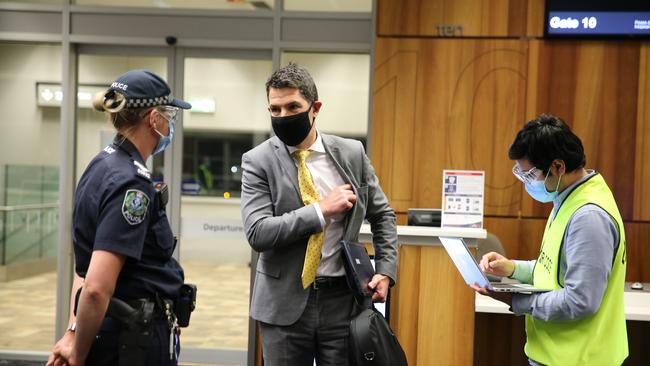 Alex Antic is questioned at Adelaide Airport on Thursday. Picture Dean Martin