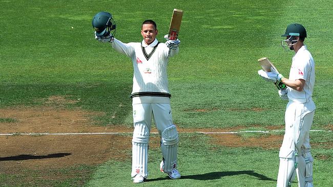 Australian batsman Adama Voges looks on as Usman Khawaja (left) reacts after scoring a century on day 2 of the first Test Match between Australia and New Zealand at the Basin Reserve in Wellington, Saturday, Feb. 13, 2016. (AAP Image/Dave Hunt) NO ARCHIVING, EDITORIAL USE ONLY, IMAGES TO BE USED FOR NEWS REPORTING PURPOSES ONLY, NO COMMERCIAL USE WHATSOEVER, NO USE IN BOOKS WITHOUT PRIOR WRITTEN CONSENT FROM AAP