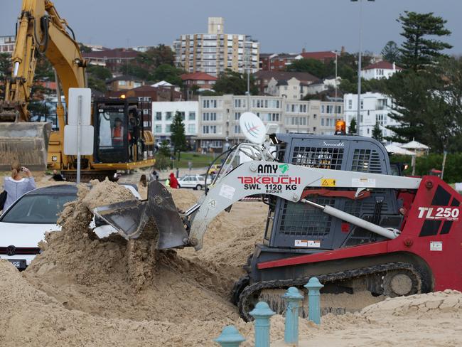 Clean up of sand at Bondi Beach after wild storms. Picture: Craig Wilson