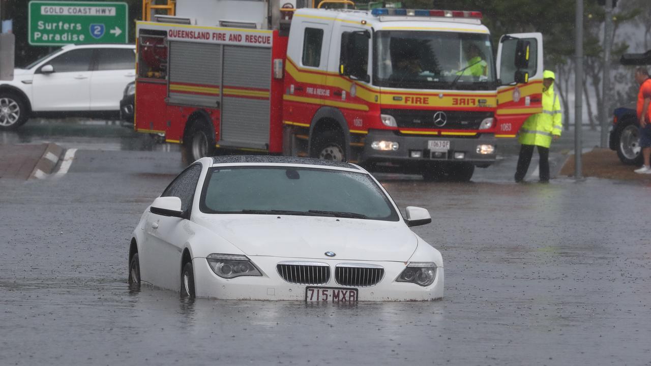 A car is flooded on Queen St in Southport after a storm lashes the Gold Coast. Photograph: Jason O'Brien