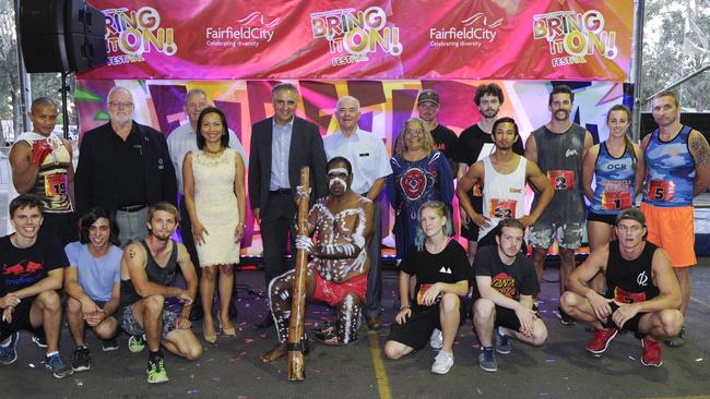 Councillor Dai Le, Mayor Frank Carbone, Cabra-Vale Diggers board members, Aunty Wendy Morgan, didgeridoo performer JahMarley Dawson with Fairfield Warrior finalists. Picture: Fairfield Council