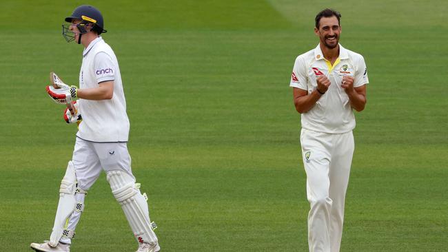 Mitchell Starc (R) celebrates taking the wicket of England's Harry Brook. Picture: AFP