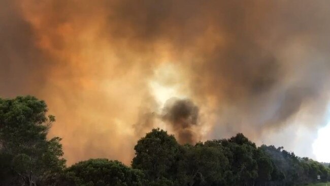 Residents at Peregian Beach are being evacuated as a bushfire flares. Picture: Lachie Millard