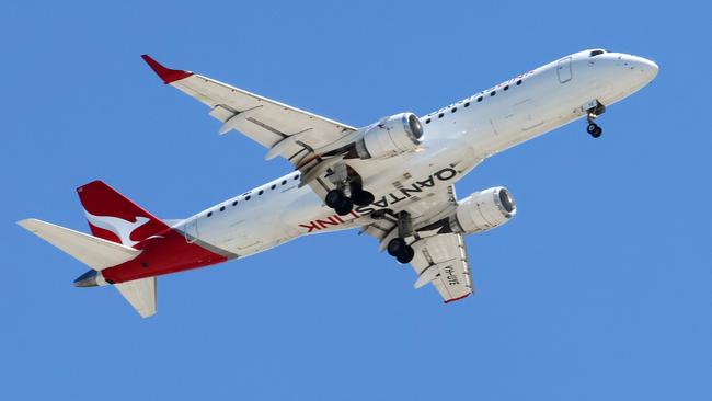 BRISBANE, AUSTRALIA - NewsWire Photos SEPTEMBER 30, 2024: A Qantas plane prepares to land in Brisbane. Hundreds of Qantas workers went on strike today demanding higher wages. Picture: NewsWire/Tertius Pickard