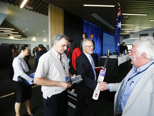 The Liberal State Conference / Council held at Blundstone Arena on Sunday. Pictured is Scott Morrison signing a bat for Tasmania Honey maker, Lindsay Bourke. Picture: MATT THOMPSON