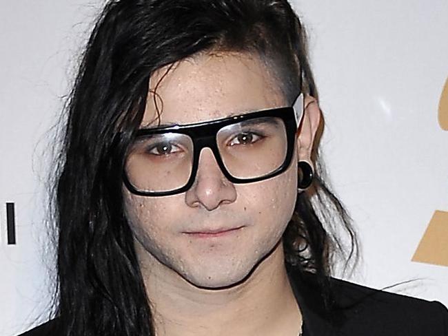 Skrillex poses on the red carpet upon arrival for the Clive Davis And The Recording Academy's 2012 Pre-Grammy Gala And Salute To Industry Icons at the Beverly Hilton Hotel in Beverly Hills, California, February 11, 2012. AFP PHOTO Joe KLAMAR