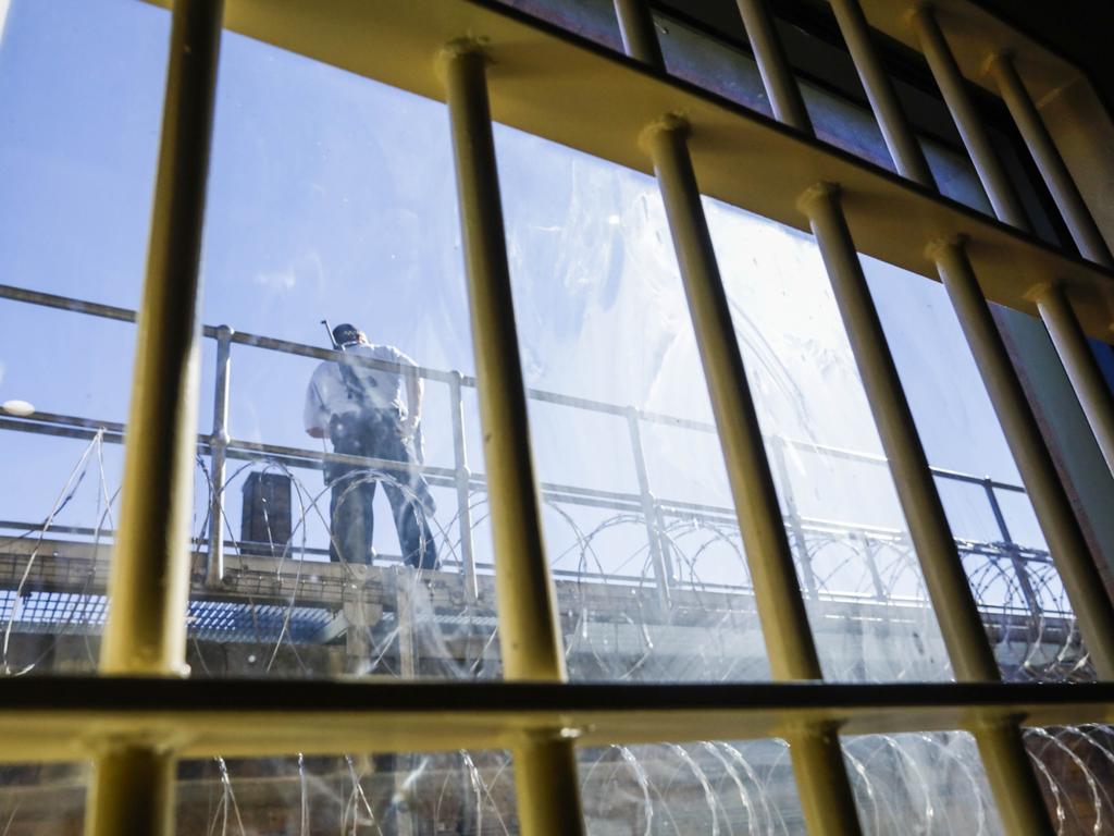 A guard on duty as seen from a window in a common room in the newly refurbished High Risk Management Correctional Centre Area 2 at Goulburn Jail, Goulburn, NSW. Picture: Sean Davey