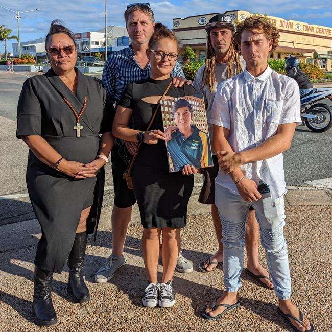 The family of 13-year-old Bailey Pini stand together holding his portrait, after the final day of the coronial inquest into his death in Bowen. (L to R): Aunt Angela Styles, brother-in-law Luke Jackson, sister Troydon Pini and brothers Kaylen and Jericho.