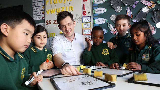 Troy Verey with prep students at Marsden Road Public School in Liverpool, western Sydney. Picture: James Croucher