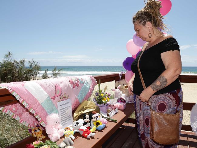 Jodie Devere of the Gold Coast pays tribute to the baby that was found dead on the beach in Surfers Paradise near Staghorn Ave. Photo: Tertius Pickard