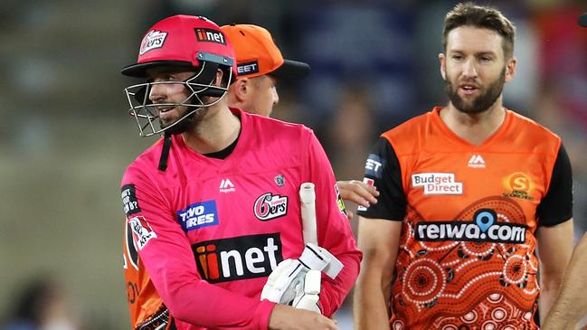 CANBERRA, AUSTRALIA - JANUARY 30: James Vince of the Sixers shows his frustration as he walks away from Andrew Tye of the Scorchers after Tye bowled wide that gave the Sixers the win and left Vince not out on 98 during the Big Bash League match between the Sydney Sixers and the Perth Scorchers at Manuka Oval, on January 30, 2021, in Canberra, Australia. (Photo by Mark Kolbe/Getty Images)