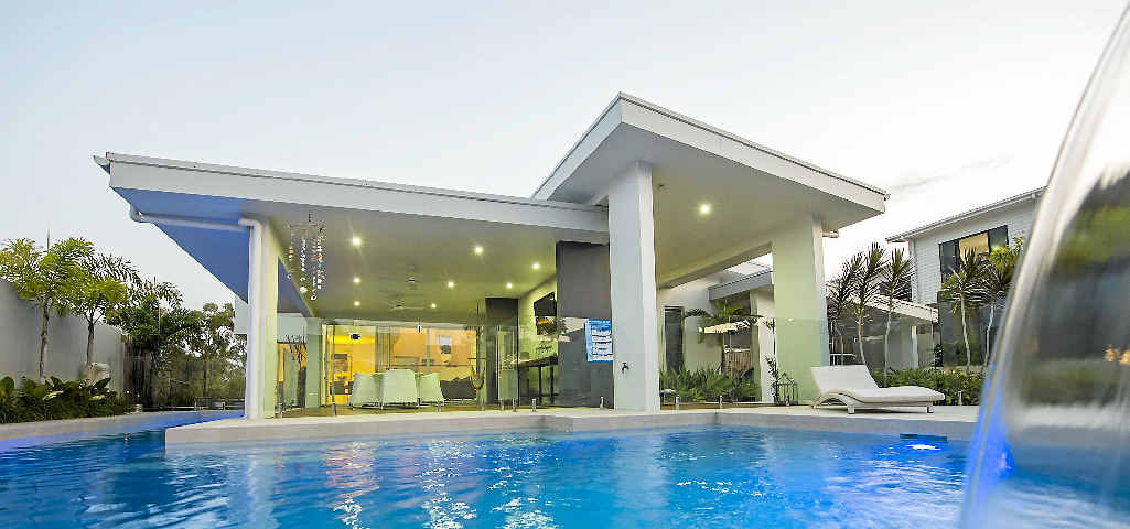 ELEGANT LIVING: The view from the in-ground pool into the house at Cormorant Cl that’s for sale for $1.99 million. Picture: Craig Chapman