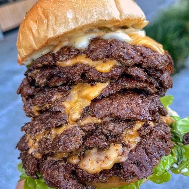 An absolute monster of a burger, this one is a truffle burger special with nine patties and nine slices of cheese. Picture: Wing Fix.