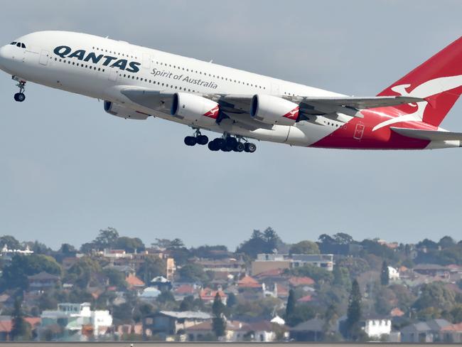 (FILES) A file photo taken on August 25, 2017, shows a Qantas Airbus A380 taking off from the airport in Sydney. - Australian flag carrier Qantas posted a 14.9 percent jump in annual net profit on August 23, 2018 with healthy returns across all sectors of its business. (Photo by Peter PARKS / AFP)