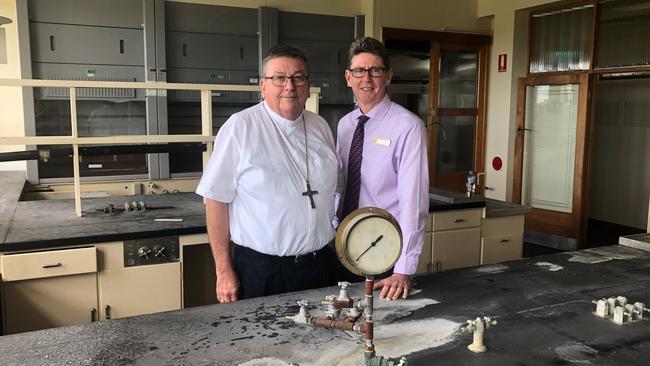 Bishop Michael McCarthy and Catholic Education assistant director of schools Michael McCusker in the science laboratories at the historic Sugar Research Institute Building on Nebo Road that will be transformed for future students.