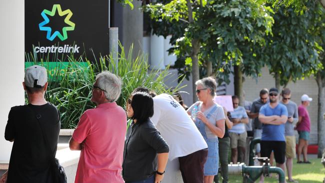 Unemployed workers queue outside a Centrelink in Queensland. Picture: Glenn Hampson