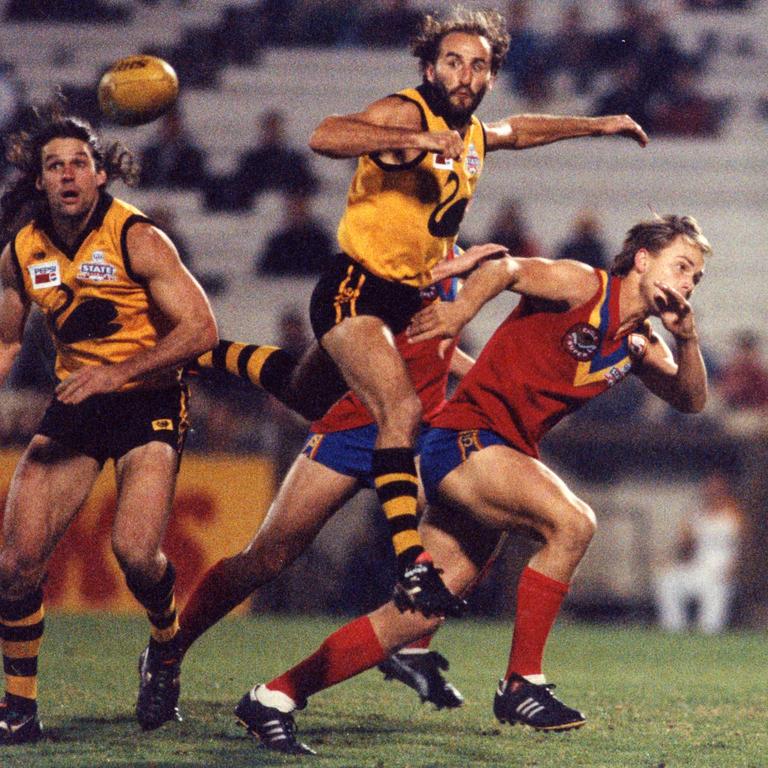 It’s been over 25 years since the last AFL State of Origin match. Pictured is a match between SA and WA at Football Park, SA, in June 1993. Players from left are Mark Zanotti, John Gastev and Tony Modra. Picture: file image