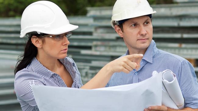 young engineer woman shows her co-worker around the site