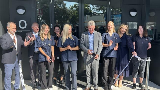 TAFE Minister Steven Whan alongside teachers and students at the opening of the new animal studies training centre at Wyong Tafe.