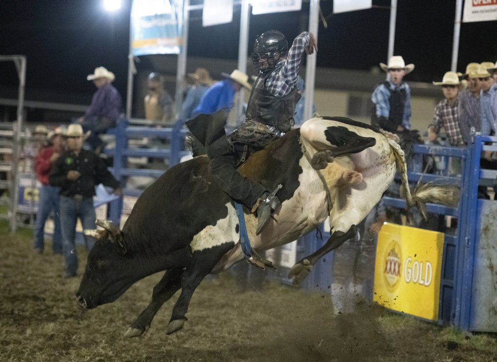 Mick Knight rides in the open bullride at the Lawrence Twilight Rodeo. Picture: Adam Hourigan