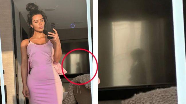 The image of a woman appears in the background of Kim's selfie. Image: Instagram 