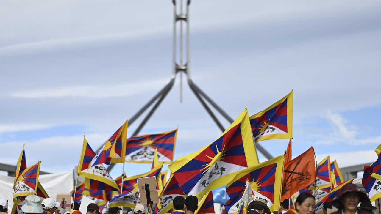 Human rights protesters gathered on the Parliament House lawn on Wednesday, as Penny Wong met Wang Yi. Picture: NCA NewsWire / Martin Ollman