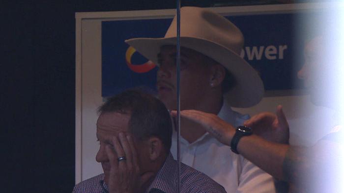 Walsh's fashion statement in Broncos coaches box.