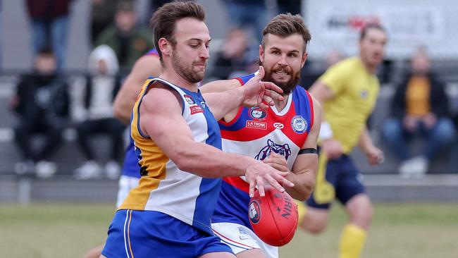 Lucas Hobbs gets a kick for Macleod. Picture: George Salpigtidis