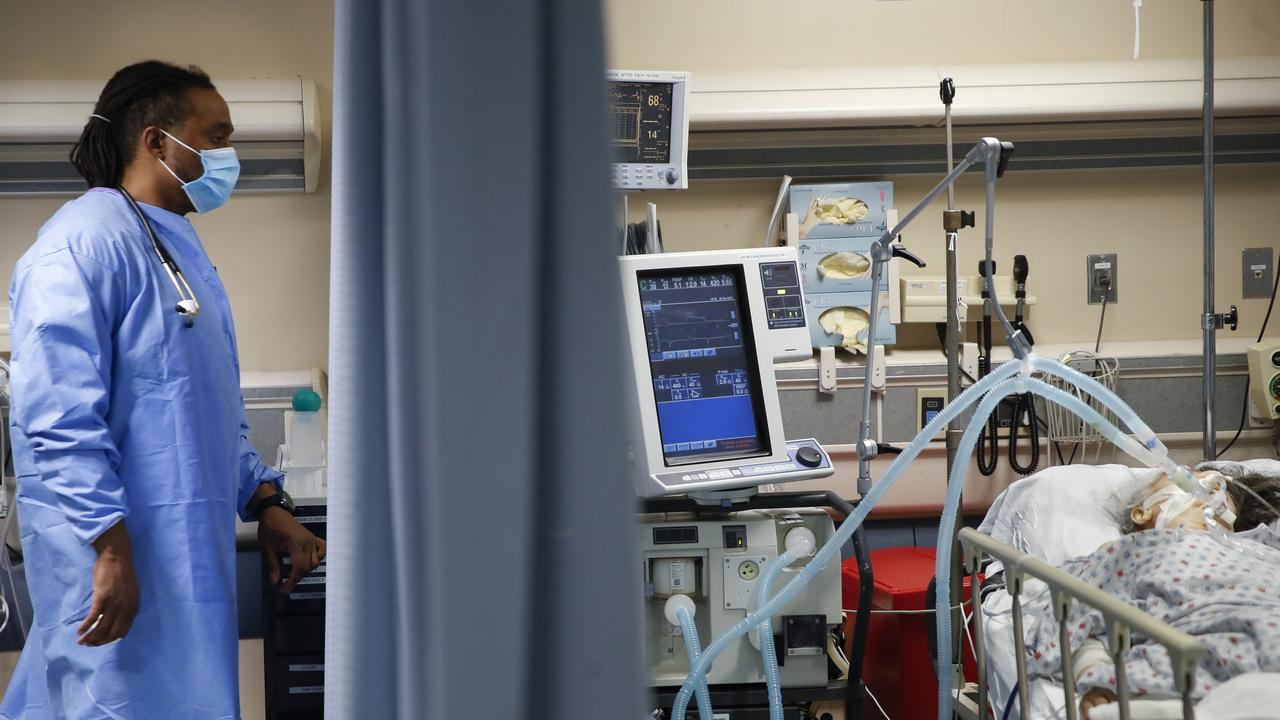 A respiratory specialist looks over a patient at St. Joseph's Hospital in New York. Picture: John Minchillo/AP