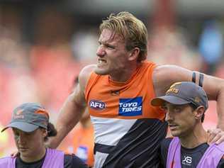 Lachlan Keeffe of the Giants is injured and leaves the field  during the Round 1 AFL match between the GWS Giants and Essendon Bombers at the Sydney Showgrounds Stadium, Sunday, March 24, 2019. (AAP Image/Craig Golding) NO ARCHIVING, EDITORIAL USE ONLY. Picture: CRAIG GOLDING