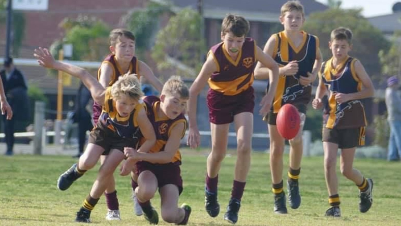 SA Little Legend Jet Fawcett, 11, "may be little but he is fierce". The young footballer is pictured here during the recent School Sport SA Sapsasa State Football Carnival. Jet, representing Western Eyre Peninsula, is laying a tackle on a young Central Eyre player. Picture: Supplied