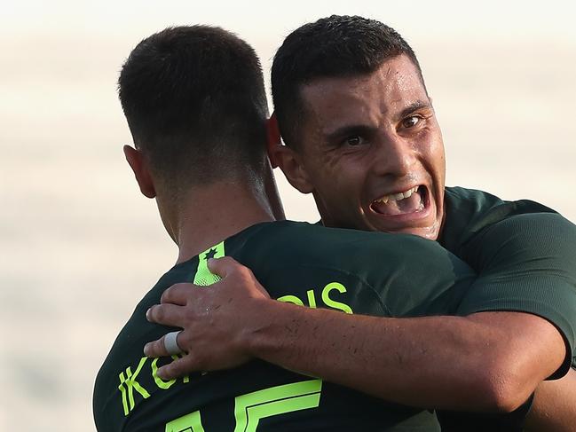 DUBAI, UNITED ARAB EMIRATES - DECEMBER 30:  Chris Ikonomidis and Andrew Nabbout of Australia celebrates their second goal during the International Friendly match between Australia and Oman at Maktoum Bin Rashid Al Maktoum Stadium on December 30, 2018 in Dubai, United Arab Emirates.  (Photo by Francois Nel/Getty Images)