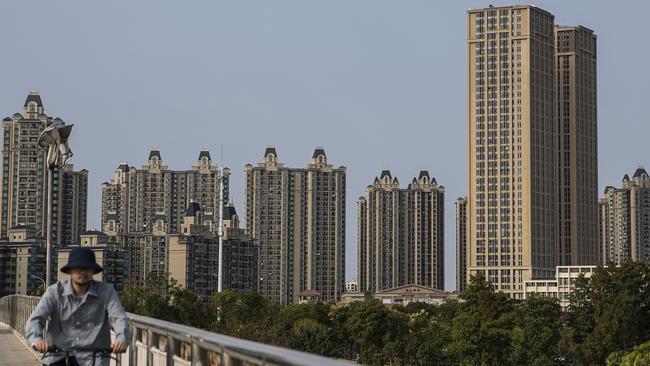 A resident cycles through the Evergrande city during the last day of the National Day and Golden Week holidays on October 7, 2021 in Wuhan, Hubei province, China. Picture: Getty Images