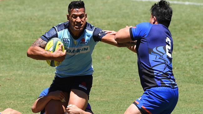 Israel Folau runs the ball for the Warratahs on day one of the Global Rugby Tens at Suncorp Stadium.