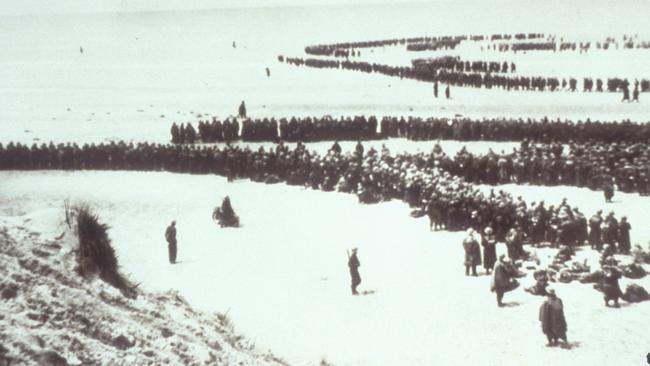 Troops of the British Expeditionary Force crowd the shores of Dunkirk in 1940, awaiting their evacuation.