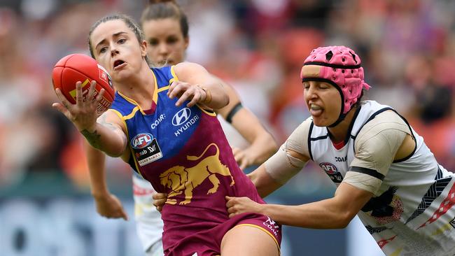 Hard at it ... Heather Anderson tackles Brisbane’s Jessica Wuetschner during the AFLW Grand Final. Picture: Dan Peled (AAP)