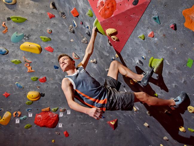 State champion rock climber Hugo Hornshaw, 14, trains at The Edge Rock Climbing Centre at Castle Hill. Hugo is among the rising number of young people across the world who were instantly hooked on the sport. Pictures: Troy Snook