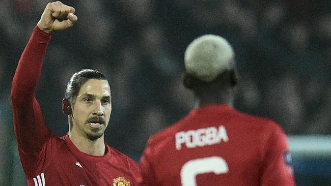 Manchester United's Swedish striker Zlatan Ibrahimovic (L) celebrates with Paul Pogba.