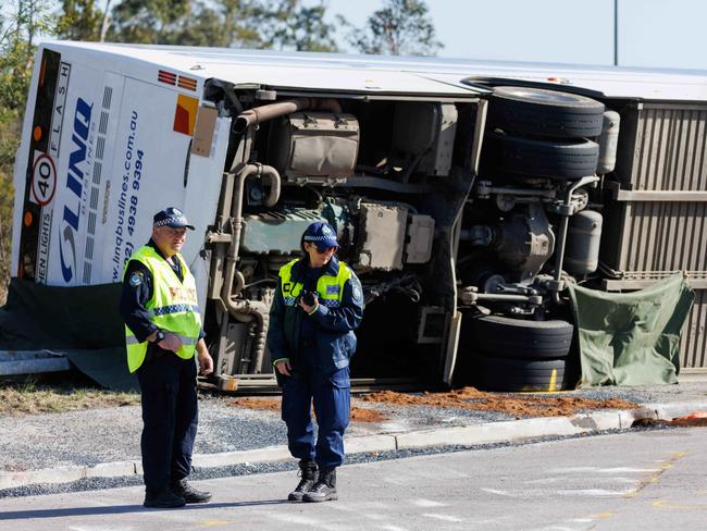 Police survey the area after a bus crash in the Hunter Valley that claimed 10 lives and injured 25. Picture: David Swift