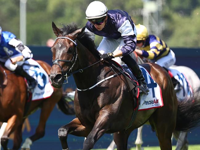 SYDNEY, AUSTRALIA - MARCH 23: Tom Marquand riding Post Impressionist wins Race 2 Precise Air N E Manion Cup during the Golden Slipper Day - Sydney Racing at Rosehill Gardens on March 23, 2024 in Sydney, Australia. (Photo by Jeremy Ng/Getty Images)