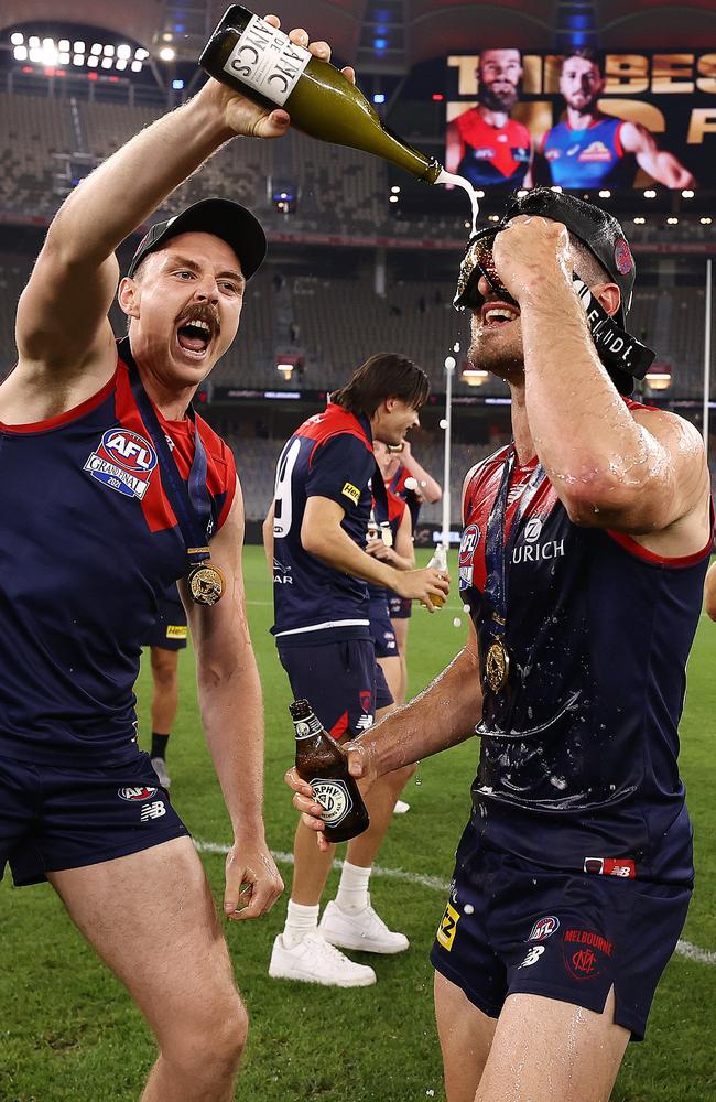 Jake Lever pours champagne on Alex Neal-Bullen. Picture: Michael Klein