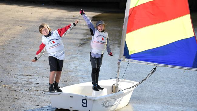 Henry, 10, and Lottie, 9, celebrate the removal of the black sludge. Picture: Penny Stephens