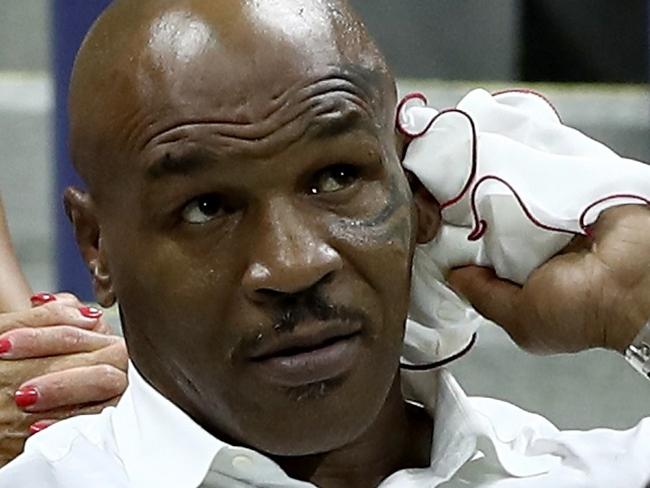 NEW YORK, NY - AUGUST 29: Mike Tyson watches the first round Men's Singles match between Novak Djokovic of Serbia & Montenegro and Jerzy Janowicz of Poland on Day One of the 2016 US Open at the USTA Billie Jean King National Tennis Center on August 29, 2016 in the Flushing neighborhood of the Queens borough of New York City. Elsa/Getty Images/AFP == FOR NEWSPAPERS, INTERNET, TELCOS & TELEVISION USE ONLY ==