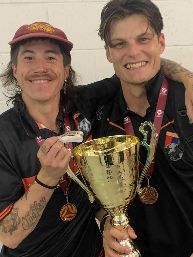 Whitsunday United players Helrado Santiago Gauna (left) and Scott Boldy after their premiership win. Picture: Supplied