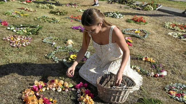 IN MOURNING: Lucy Hackett lay flowers at the memorial. Picture: Kathryn Lewis