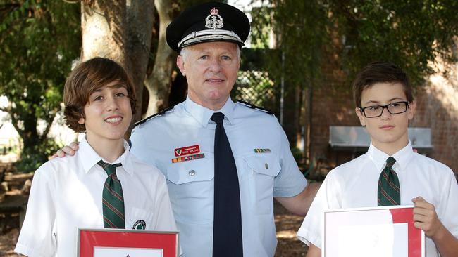 Fire & Rescue NSW Commissioner Greg Mullins presenting a CommissionerÕs Commendation to 15-year-old Jack Holland (L) and 12-year-old Kai Holland following a fire at their Cromer home. Pictured at Cromer Public School.