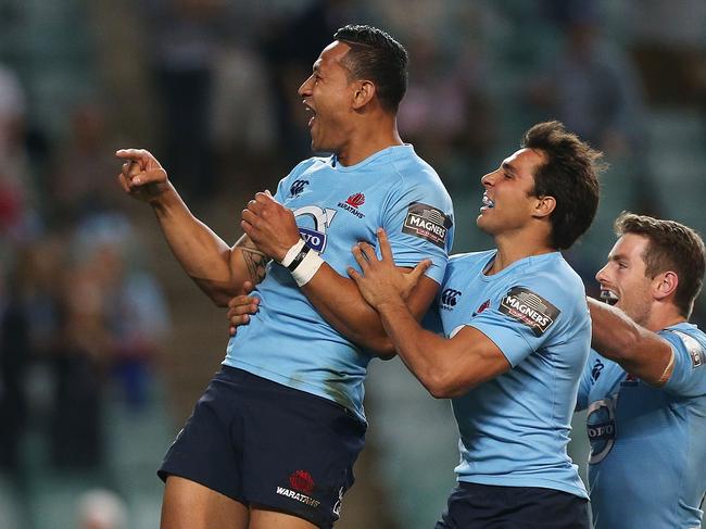 Israel Folau of the Waratahs celebrates scoring a try in 2014. Picture: Mark Metcalfe/Getty Images.