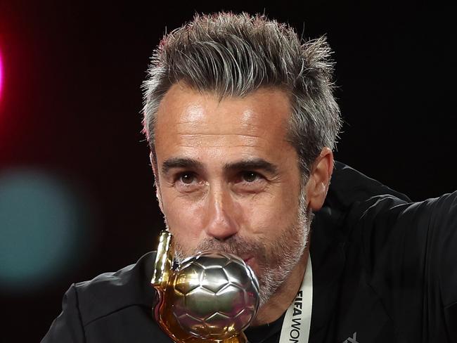 SYDNEY, AUSTRALIA - AUGUST 20: Jorge Vilda, Head Coach of Spain, kisses the FIFA Women's World Cup after his side's victory in the FIFA Women's World Cup Australia & New Zealand 2023 Final match between Spain and England at Stadium Australia on August 20, 2023 in Sydney, Australia. (Photo by Catherine Ivill/Getty Images)