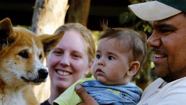 Blacktown resident Stephen Ridgeway with his wife Tatum and son Nevarda, six months, and baby dingo at Featherdale on September 2, 2005. Picture: Darren Edwards