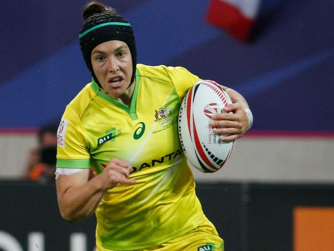 Australia's Emilee Cherry runs with the ball